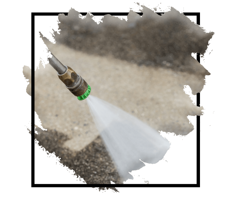 Someone using a pressure washer to clean a surface, typically with high-pressure water